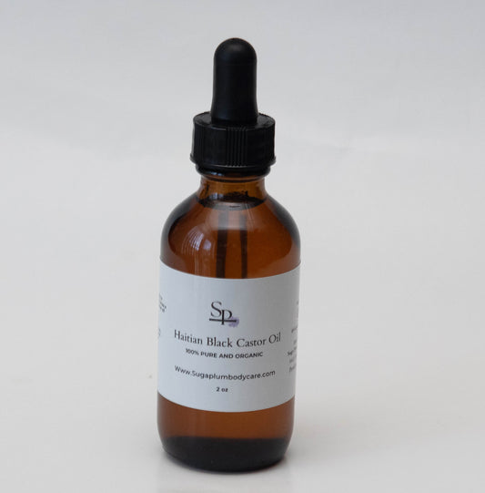 Brown glass bottle with black dropper on a white background